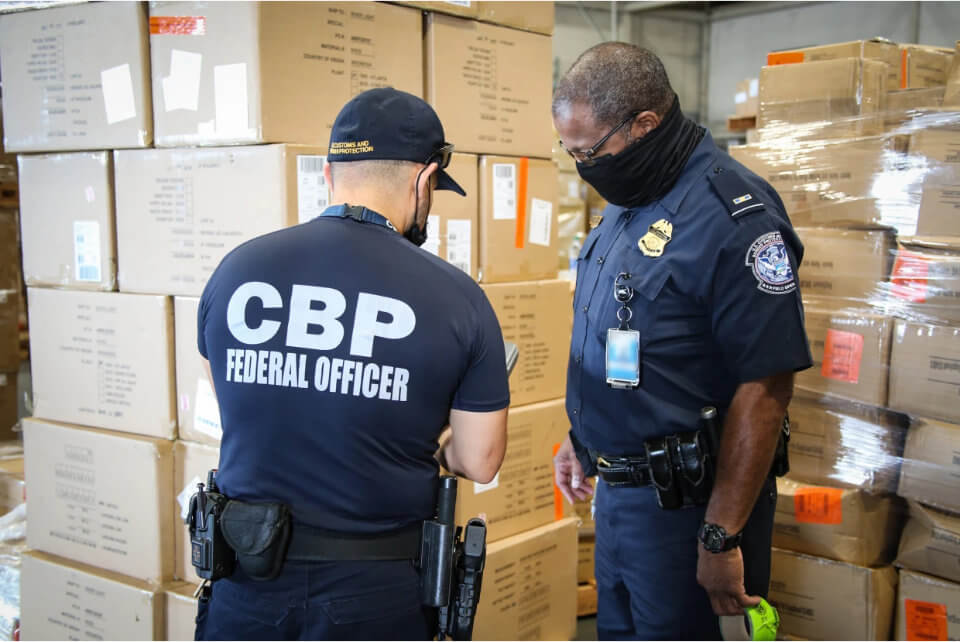 CBP officers inspect goods for import